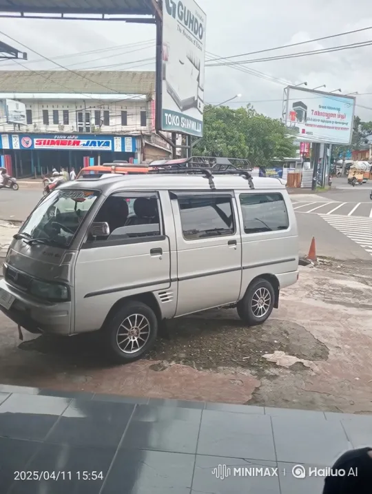 Silver Van Demonstrates Air Suspension Lowering in City Setting – AI Generated Video | Hailuo AI