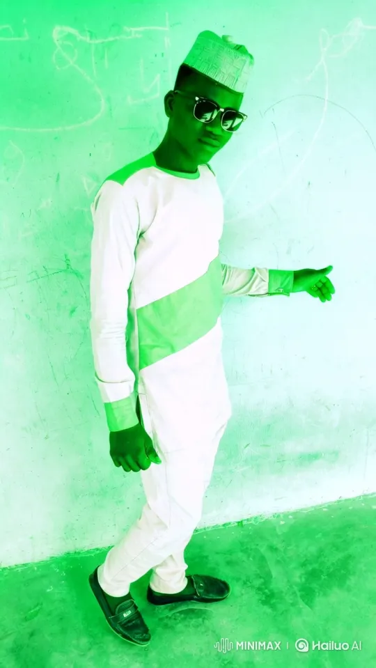 Man Poses Stylishly Against Green Wall – AI Generated Video | Hailuo AI