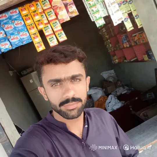Young Shopkeeper in a Colorful Shop with a Gentle Smile – AI Generated Video | Hailuo AI