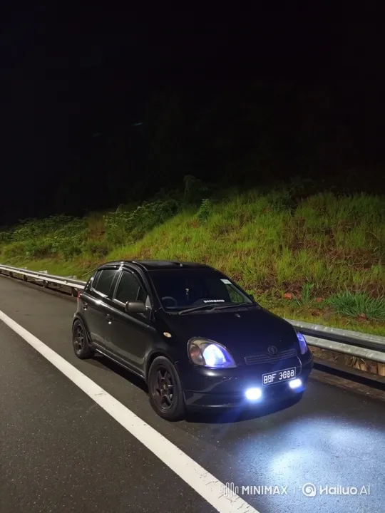 Car Lowering Its Chassis on Wet Road at Night – AI Generated Video | Hailuo AI
