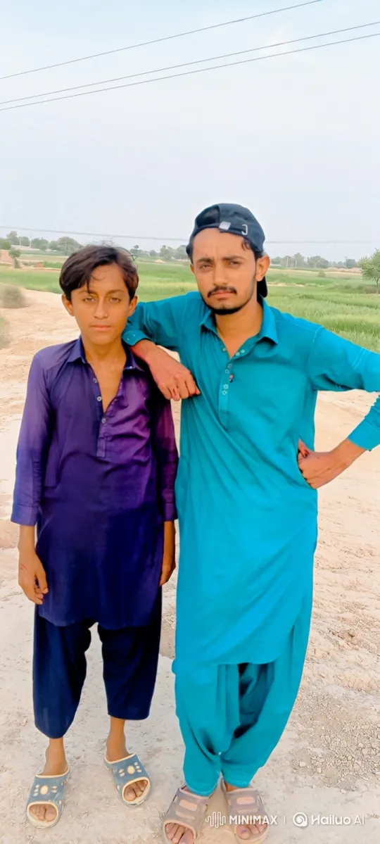Rural Portrait: Man and Boy in Tranquil Setting – AI Generated Video | Hailuo AI