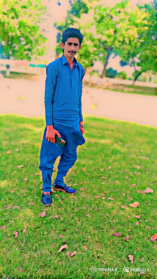 Young Man in Blue Walks Through Park – AI Generated Video | Hailuo AI