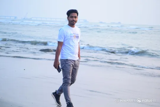 Young Man Walking on Beach with Smartphone – AI Generated Video | Hailuo AI