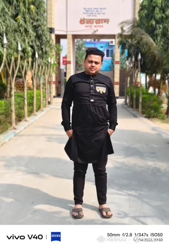 Man in Black Suit Smiles Gently on Sunny Path – AI Generated Video | Hailuo AI
