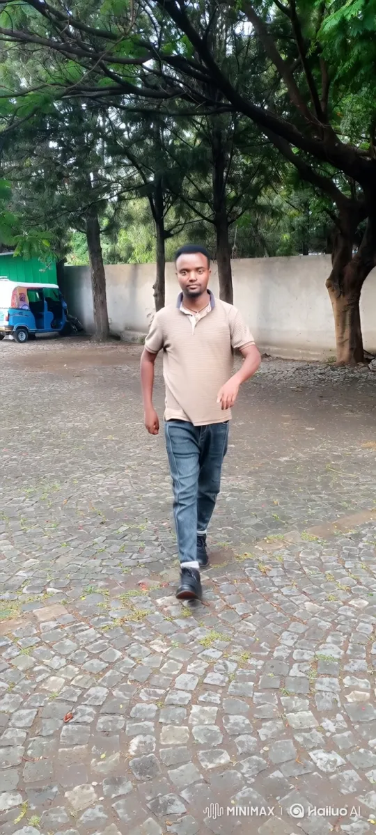 Man Walking Steadily Towards Camera in Courtyard – AI Generated Video | Hailuo AI