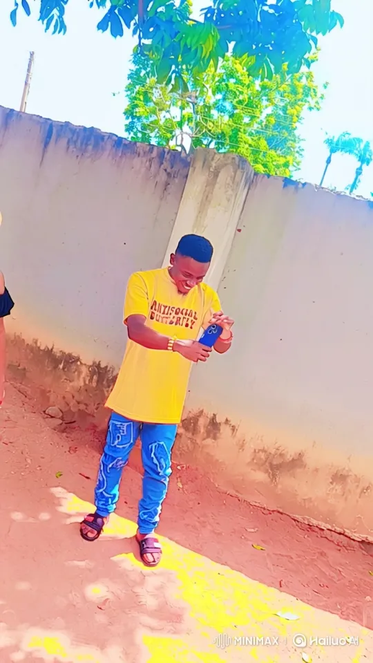 Young Man Walks and Smiles, Engrossed in Smartphone – AI Generated Video | Hailuo AI