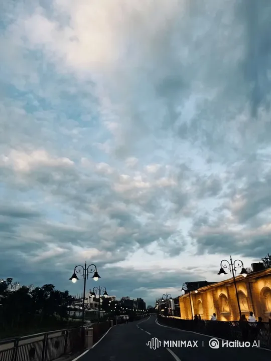 Tranquil Roadway with Elegant Architecture and Gentle Evening Glow – AI Generated Video | Hailuo AI
