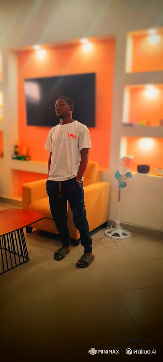 Young Man Contemplates in a Modern, Orange Room – AI Generated Video | Hailuo AI