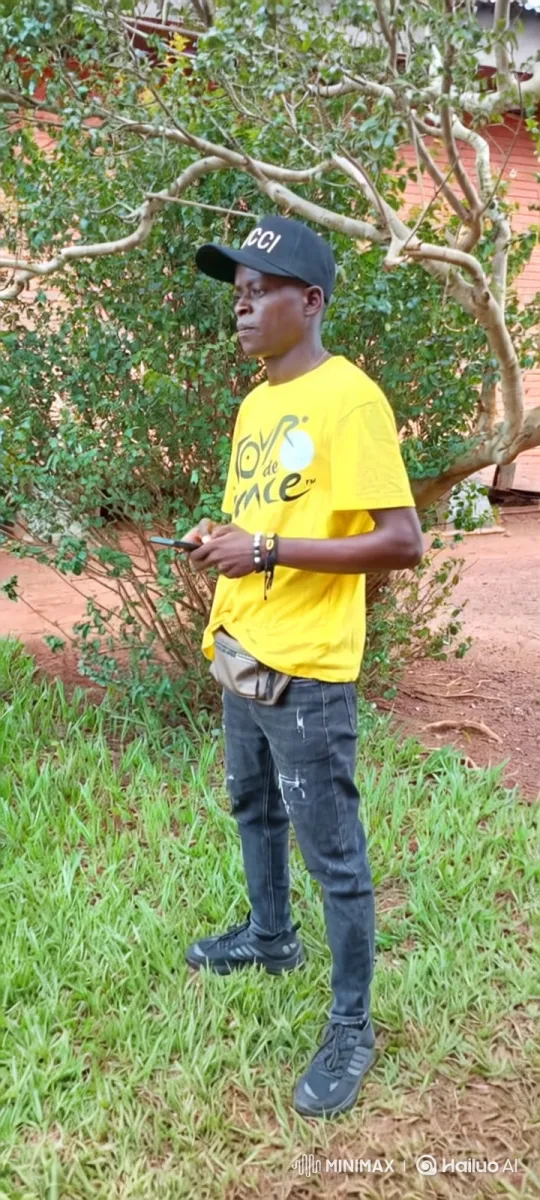 Young Man Focused on Smartphone Amidst Nature – AI Generated Video | Hailuo AI