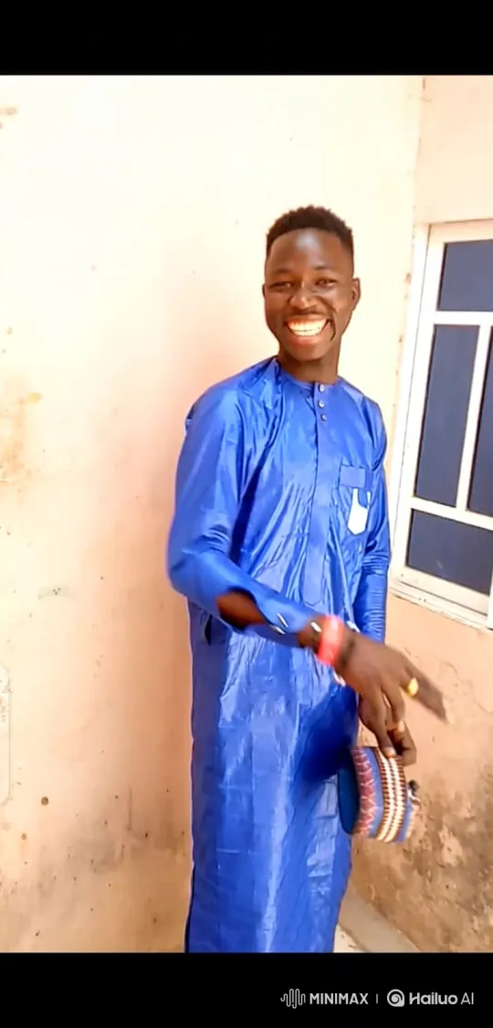 Joyful Black Man in Blue Tunic with Hat and Bracelet – AI Generated Video | Hailuo AI