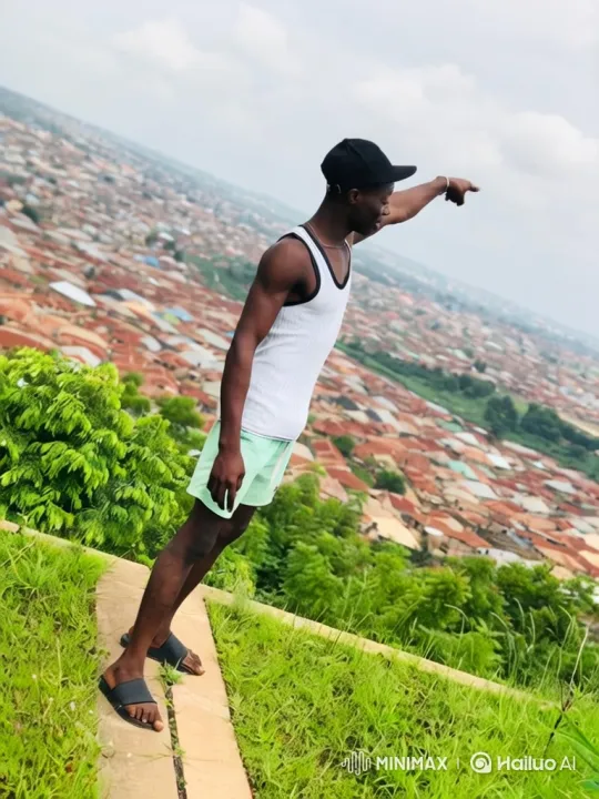 Young Man Watches Plane Fly Over City Skyline – AI Generated Video | Hailuo AI
