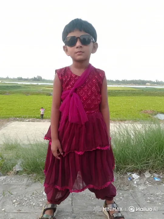 Child in Sunglasses Smiles Amidst Gentle Breeze – AI Generated Video | Hailuo AI