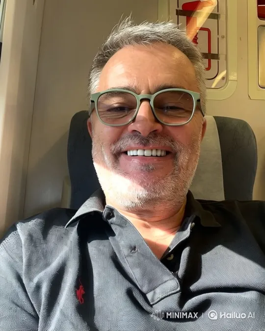 Middle-aged man reflects on journey in train – AI Generated Video | Hailuo AI