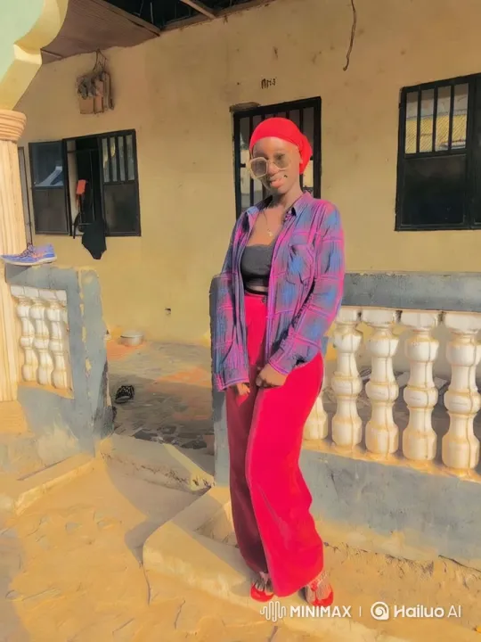 Confident Woman Showcases Vibrant Style in Sunlit Setting – AI Generated Video | Hailuo AI