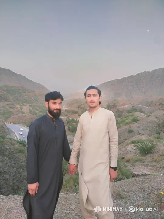 Two Men Holding Hands in Twilight Overlook Scene – AI Generated Video | Hailuo AI