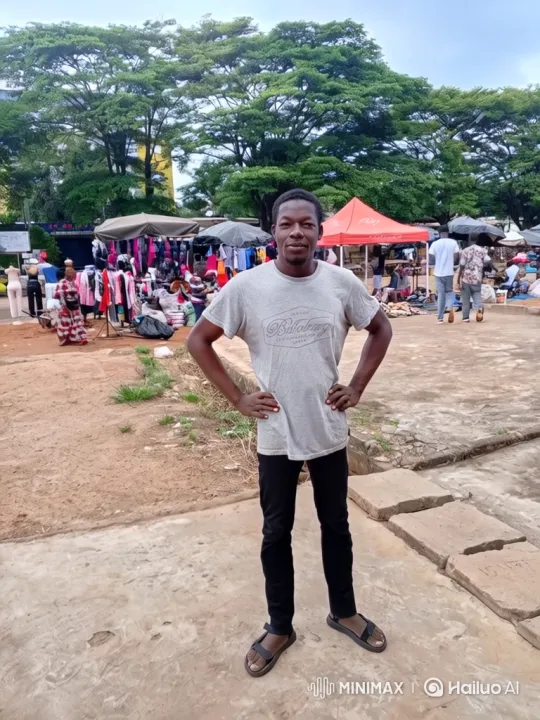 African Man in Market: A Portrait of Confidence and Warmth – AI Generated Video | Hailuo AI