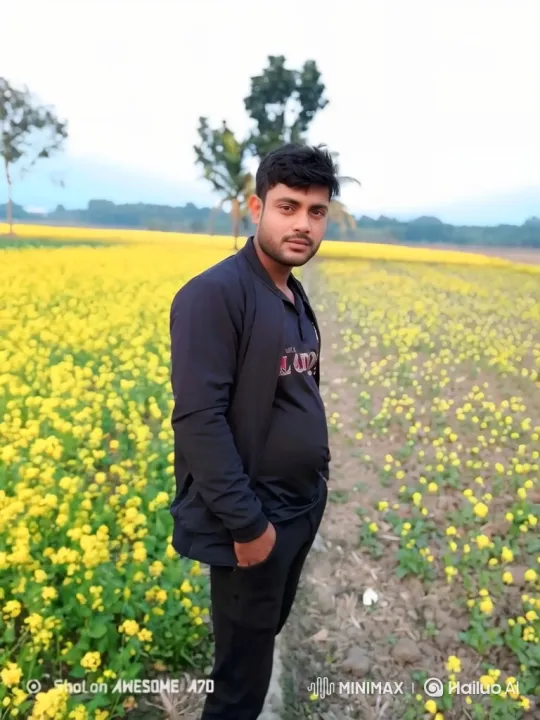 Young Man Smiles Amidst Swaying Yellow Flowers – AI Generated Video | Hailuo AI