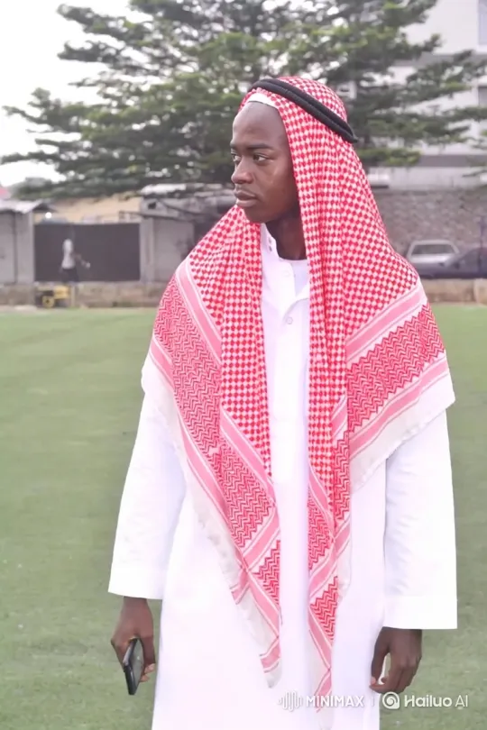 Young Man in White Robe Ponders in a Green Field – AI Generated Video | Hailuo AI