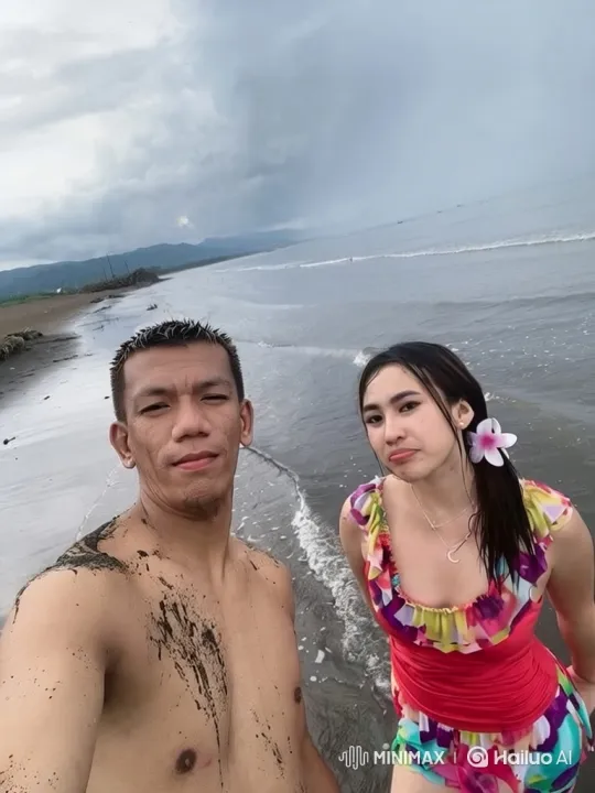 Beach Playfulness: Couple's Lighthearted Tussle – AI Generated Video | Hailuo AI