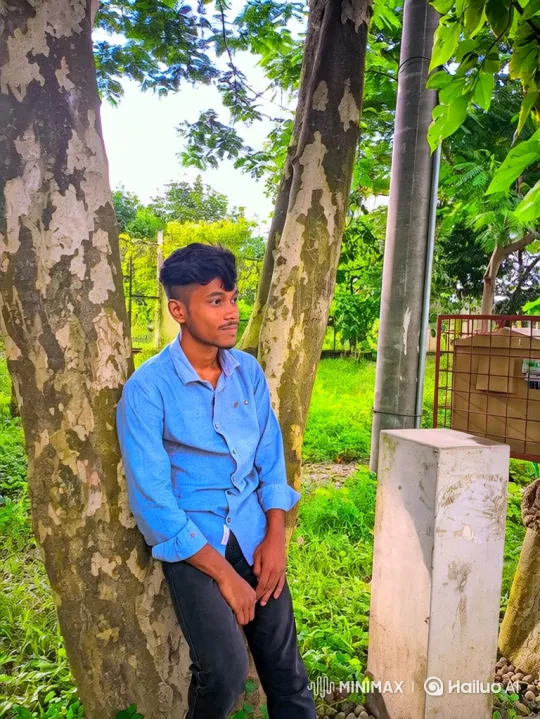 Young Man Contemplates in a Lush Park – AI Generated Video | Hailuo AI