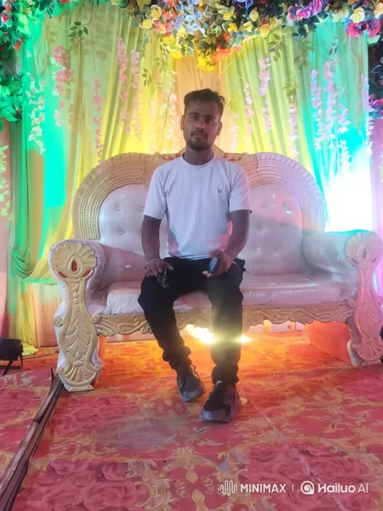 Young Man on Throne-like Sofa at Festive Event – AI Generated Video | Hailuo AI