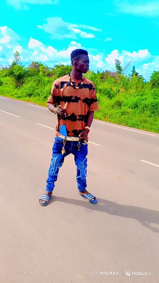 Young Man Walks Confidently Down a Sunny Road – AI Generated Video | Hailuo AI