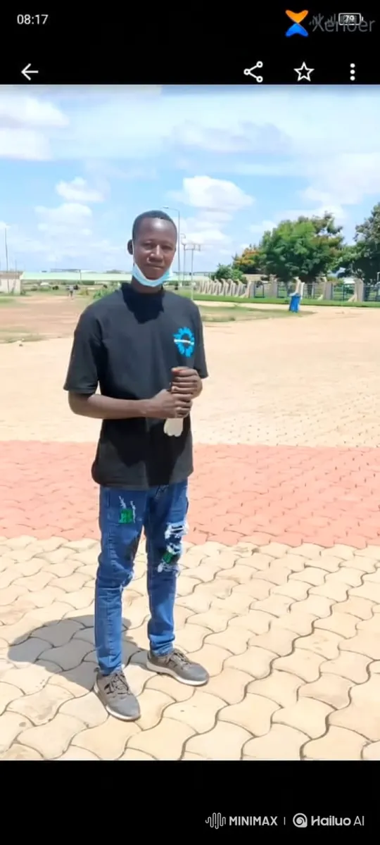 Young Man Walks Across Brick Paved Area – AI Generated Video | Hailuo AI