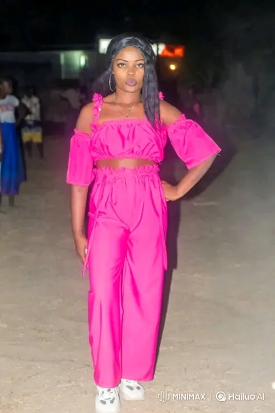 Young Woman Poses Confidently in Hot Pink Outfit at Night – AI Generated Video | Hailuo AI