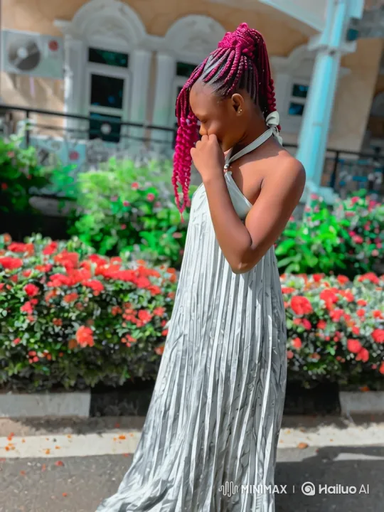 Young Woman in Silver Dress Reflects in Garden Setting – AI Generated Video | Hailuo AI