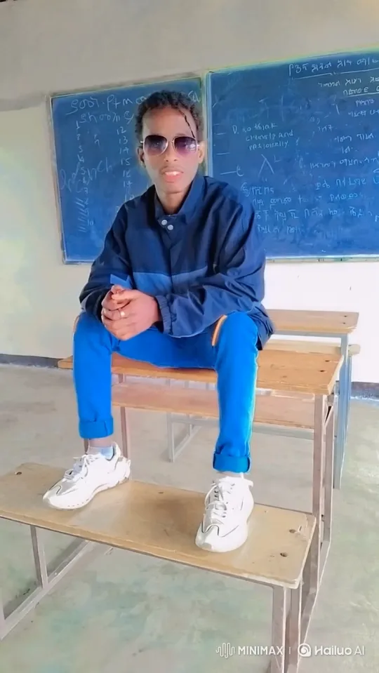 Young Man with Braided Hair and Sunglasses in Classroom – AI Generated Video | Hailuo AI