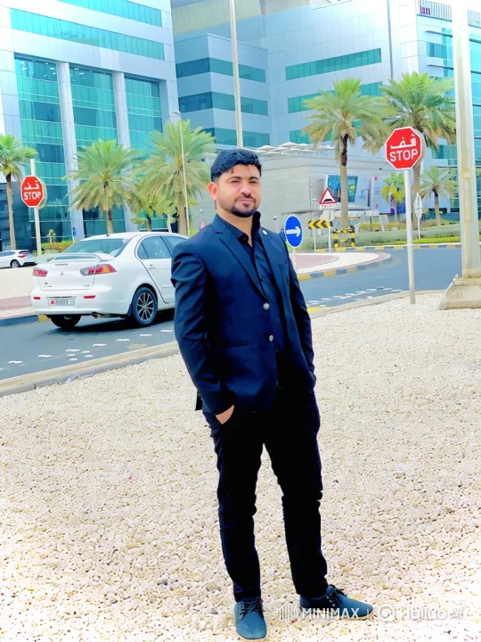 Man in Suit on Gravel Amidst Modern Building - Camera Move – AI Generated Video | Hailuo AI
