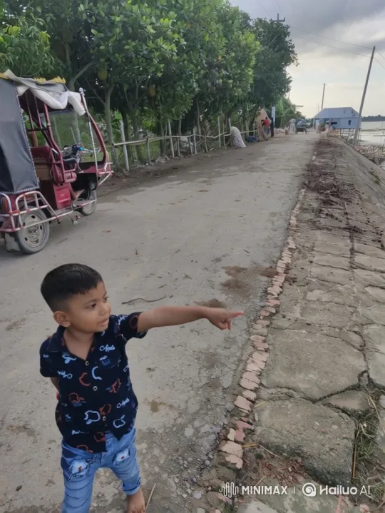 Boy Points to Distant Scene by Waterway – AI Generated Video | Hailuo AI