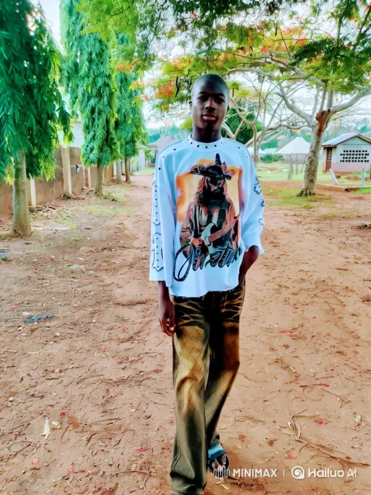 Young Black Man in Graphic Shirt Walks on Rustic Path – AI Generated Video | Hailuo AI
