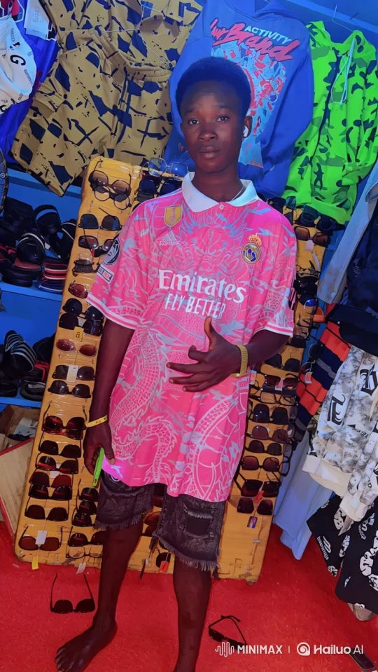 Young Man in Bright Clothing Stall Stares Calmly – AI Generated Video | Hailuo AI