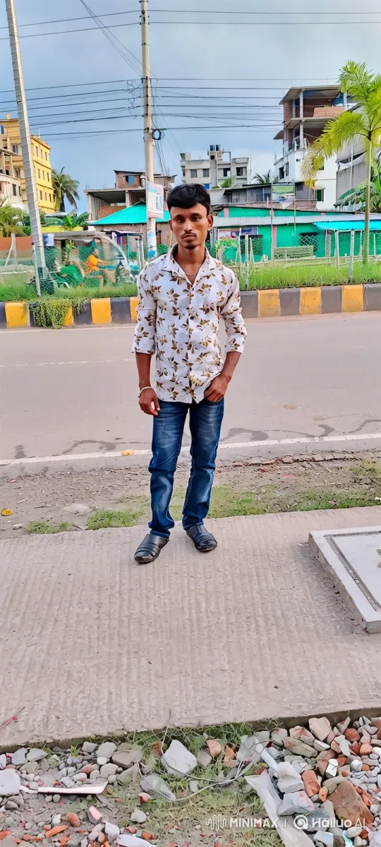 Young Man Waiting on Sidewalk Amid Urban Scene – AI Generated Video | Hailuo AI