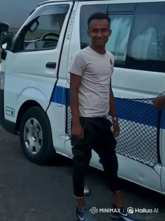 Young Man Waves Beside Animated Van – AI Generated Video | Hailuo AI