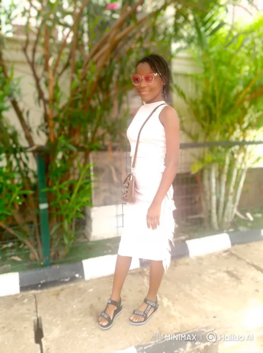 Young Woman in Summer Dress: Dynamic Tracking Shot – AI Generated Video | Hailuo AI