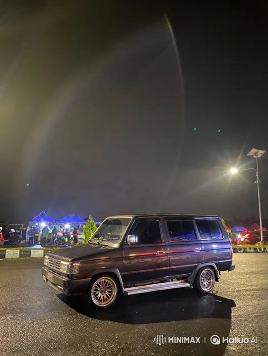 Vintage Van Lowering with Night Event Background – AI Generated Video | Hailuo AI