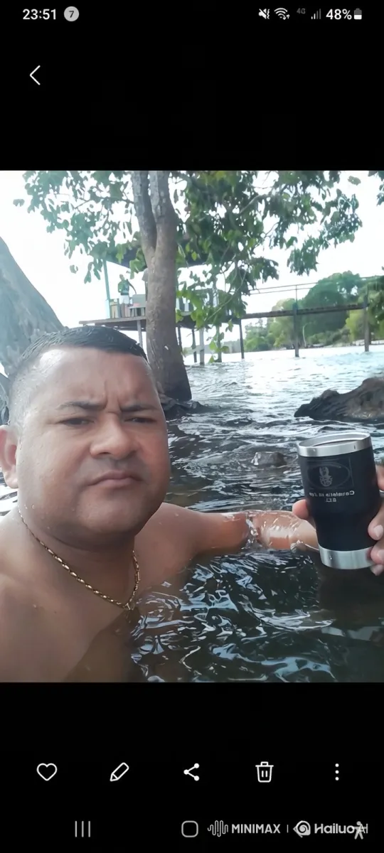 Man Takes Selfie in Flooded Area with Calm Water – AI Generated Video | Hailuo AI