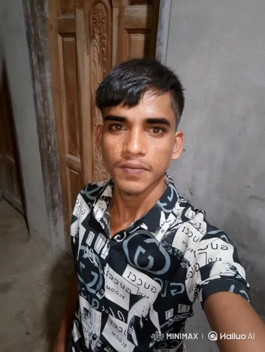 Young Man in Striped Shirt Studies Camera Steadily – AI Generated Video | Hailuo AI