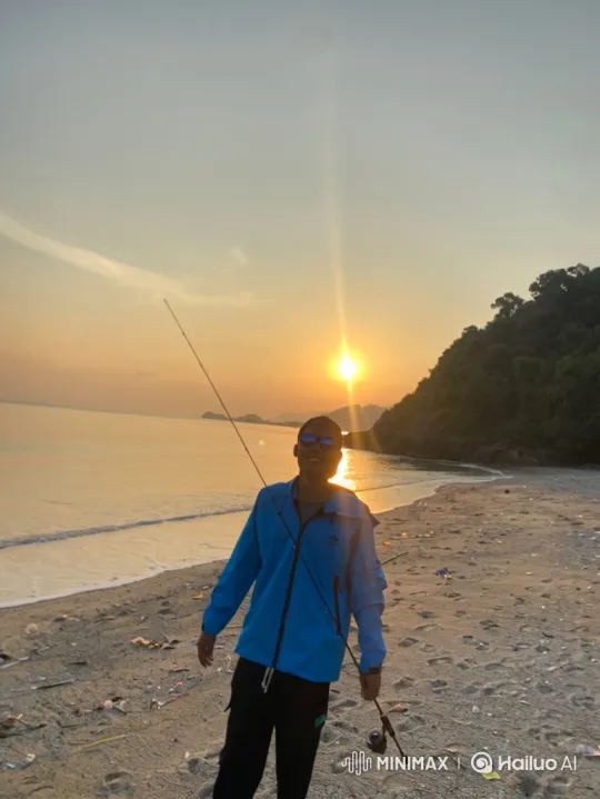 Man Fishing on Beach During Sunset – AI Generated Video | Hailuo AI
