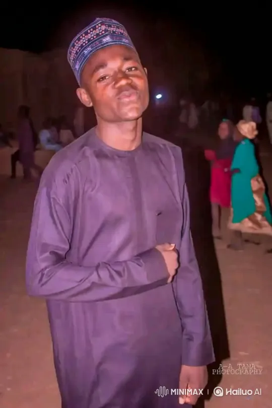Young Man Smiles During Nighttime Gathering – AI Generated Video | Hailuo AI