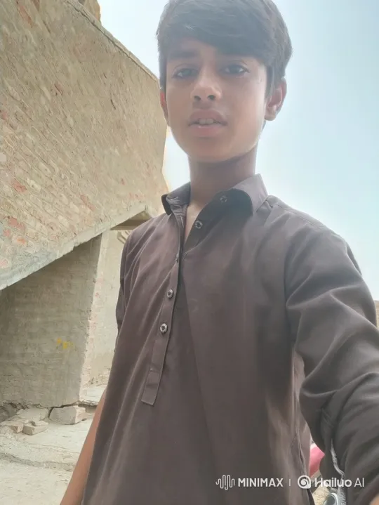 Young Boy Smiles Gently in Outdoor Setting – AI Generated Video | Hailuo AI