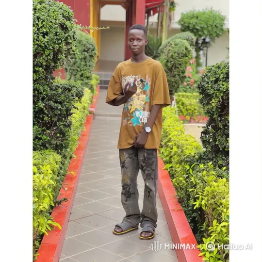 Young Man in Graphic T-Shirt on a Garden Path – AI Generated Video | Hailuo AI