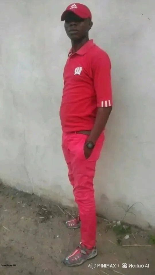 Man in Red Outfit Stands Still as Camera Moves – AI Generated Video | Hailuo AI