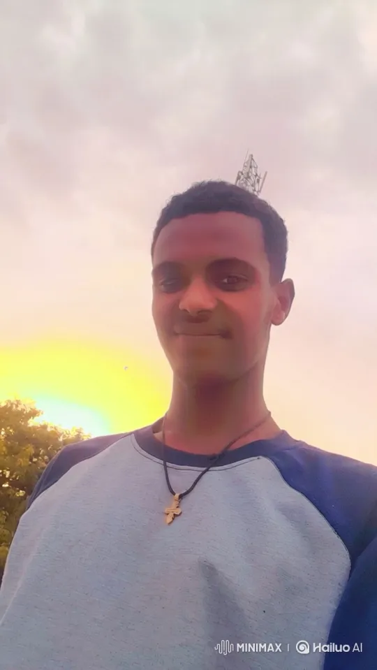 Young Man Walking in Golden Hour with Cross Necklace – AI Generated Video | Hailuo AI