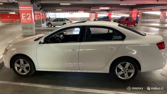 Parking Garage Pan of a White Sedan – AI Generated Video | Hailuo AI