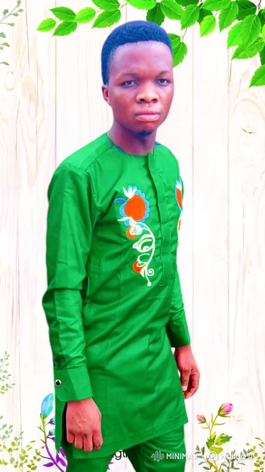 Young Man in Bright Green Stands Calmly Amidst Moving Nature – AI Generated Video | Hailuo AI