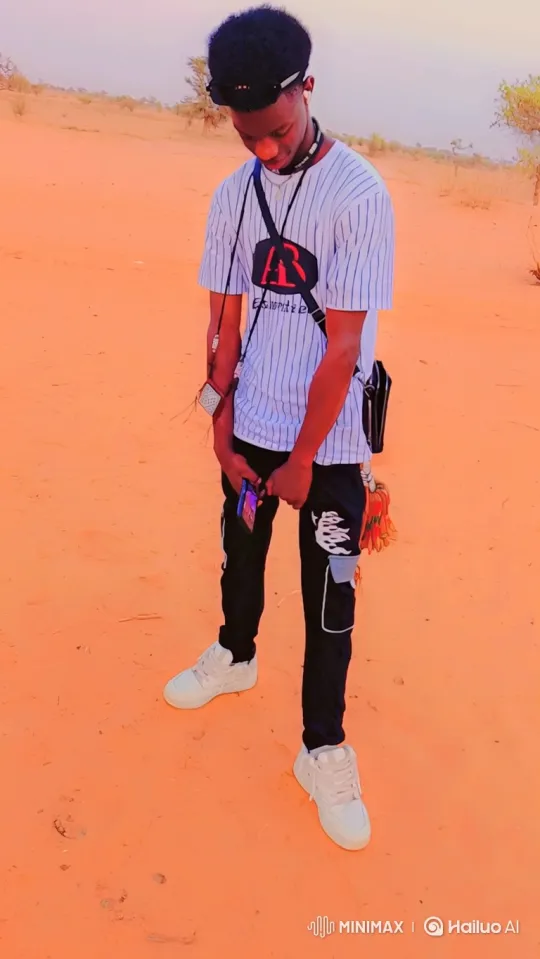 Young Man in Desert, Gazing at Horizon – AI Generated Video | Hailuo AI