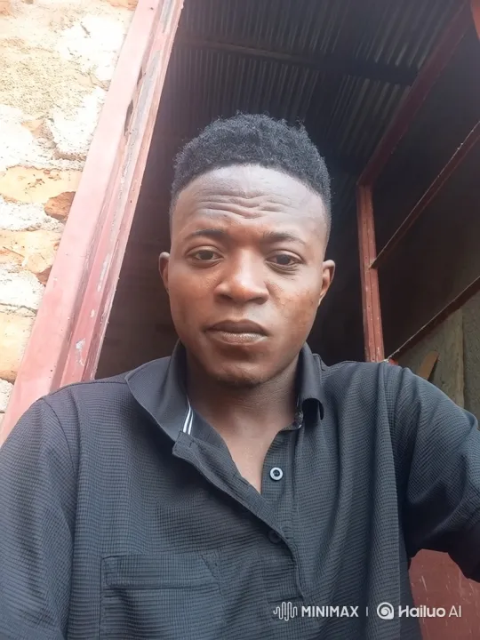 Steady Gaze of a Young Man in a Doorway – AI Generated Video | Hailuo AI